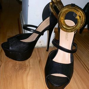 Black stilettos with gold wrap around ankle strap